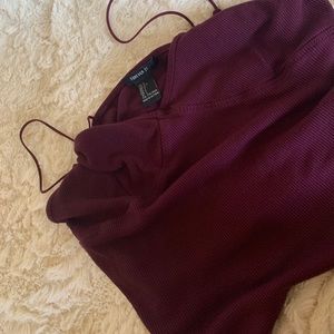 Dark purple crop top.